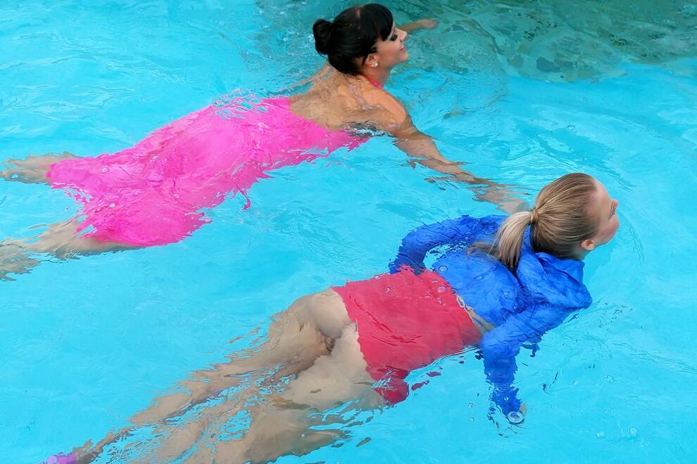 15P Fully clothed women partake in lesbian foreplay while in a swimming pool
