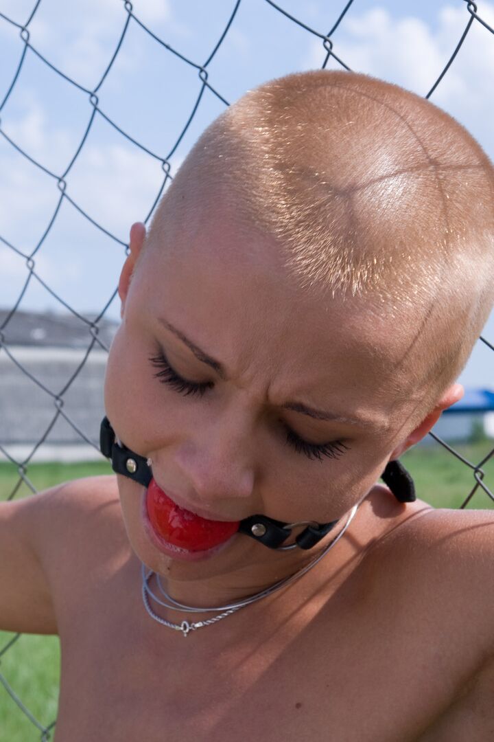 21P Shaved-headed C.J. gets ball-gagged & dominated in bondage by Sandra Romain