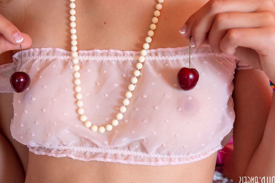 20P Three young looking girls dangle cherries while getting completely naked