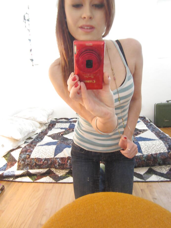 16P Brunette whore with big tits undressing and making hot photos