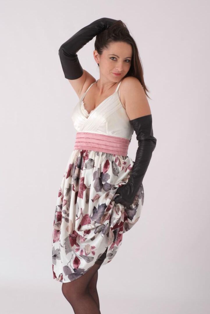 15P Solo model wears long leather gloves while disrobing to pretties and hosiery