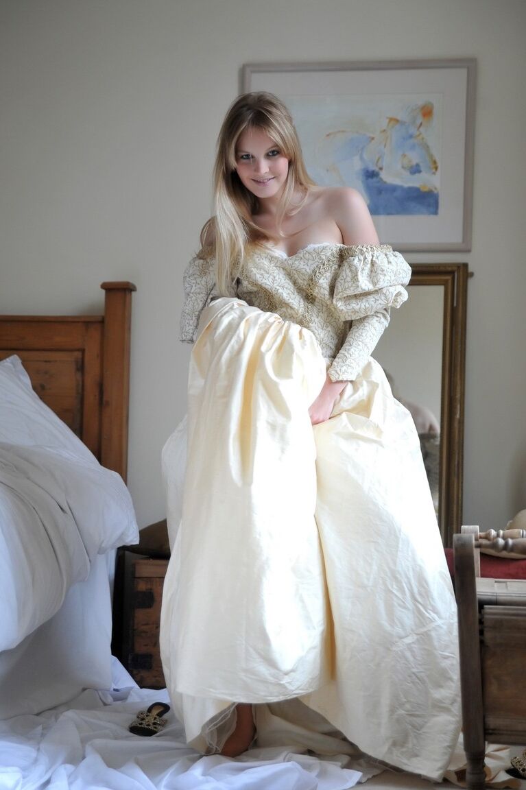 12P Blonde girl Rose takes off her petticoat to model in a girdle and nylons