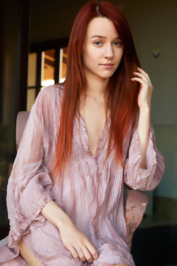 18P Long legged redhead Sherice touts her tight ass & nice pussy during a solo gig