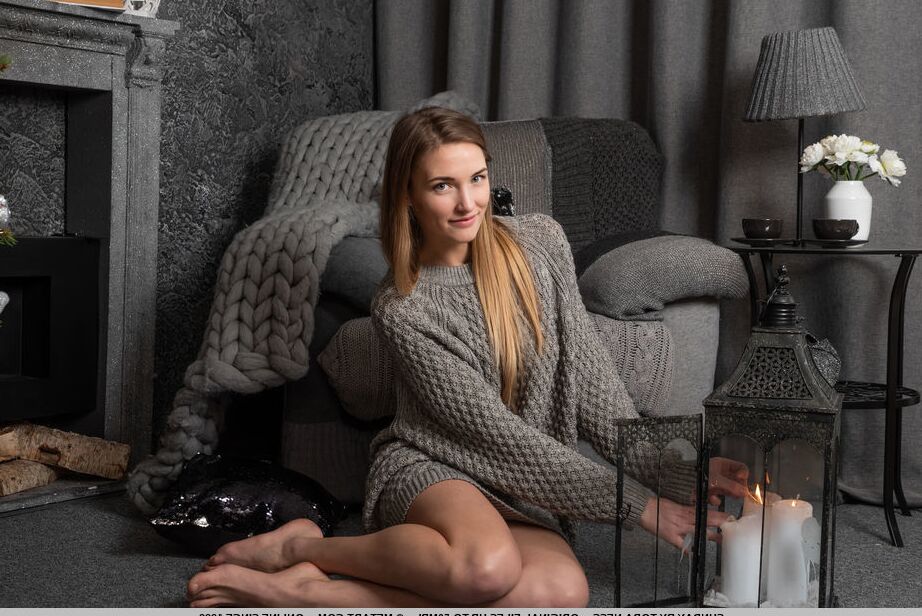 18P Long legged teen Sunday removes a sweater and underwear to model in the nude