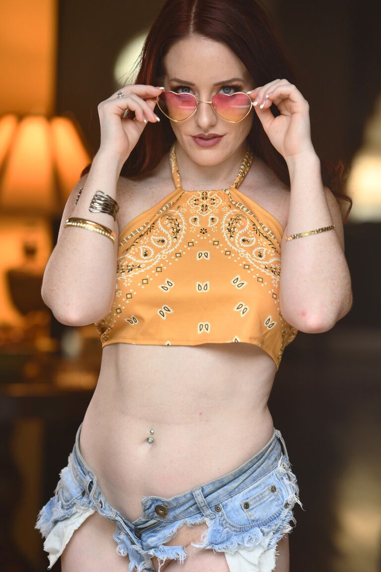 16P Sexy redhead Hannah Moore removes cutoff shorts to model in the nude