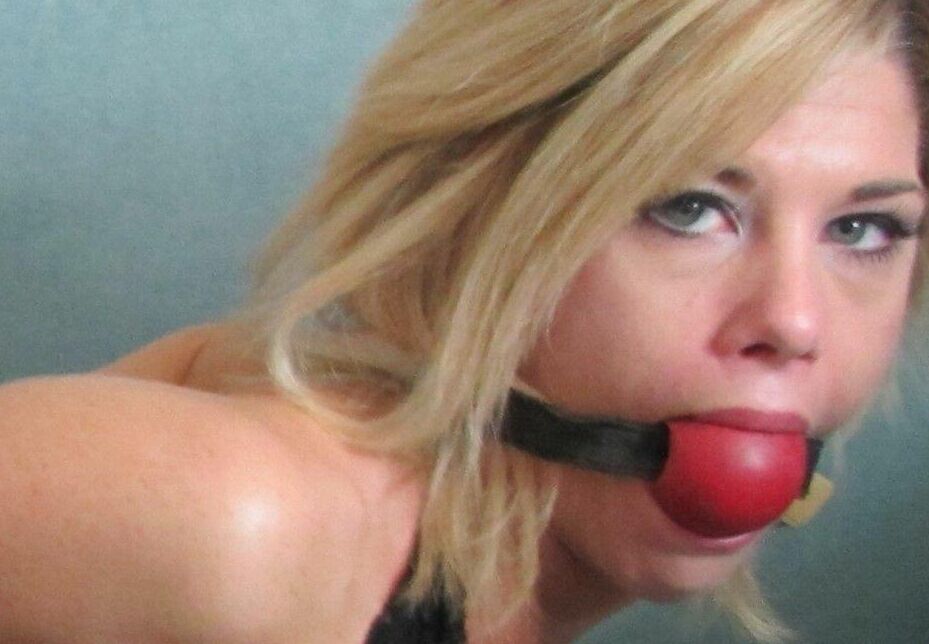 15P Blonde chick is silenced with gags while hogtied in denim cutoffs and heels