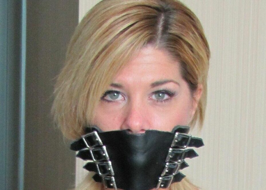 15P Blonde chick is silenced with gags while hogtied in denim cutoffs and heels