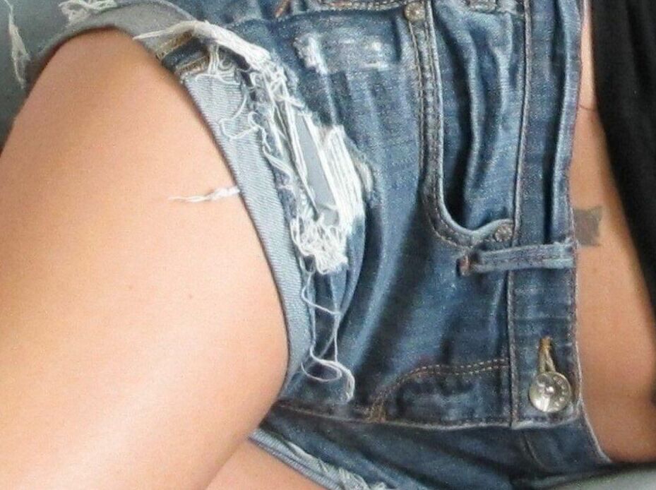 15P Blonde chick is silenced with gags while hogtied in denim cutoffs and heels
