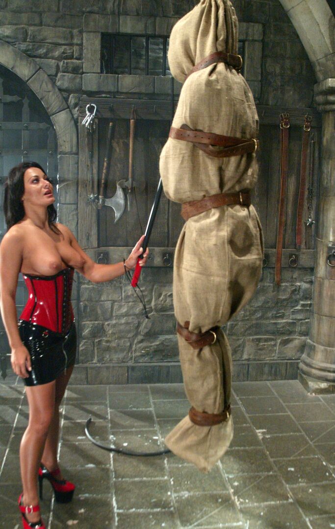 17P Brunette Domme Sandra Romain suspends a man in a bag before beating him