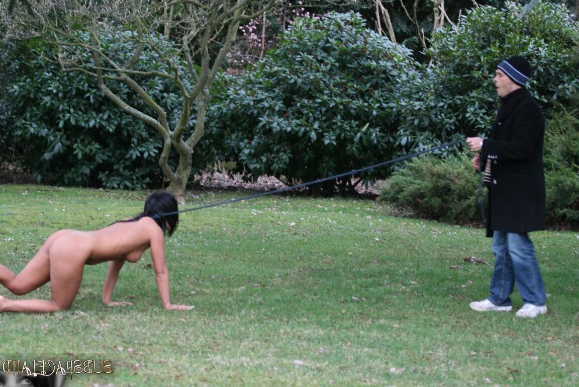 13P Female sub Barbara Devil crawls on a leash before being flogged on a cold day