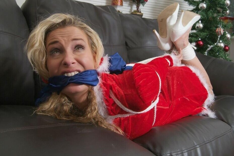 16P Blonde chick Katie C is cleave gagged and hogtied in Christmas attire