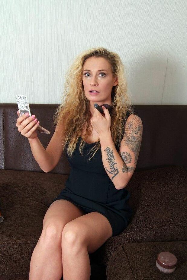 16P Tatted blonde Katie C struggles against a cleave gag while bound at her ankles