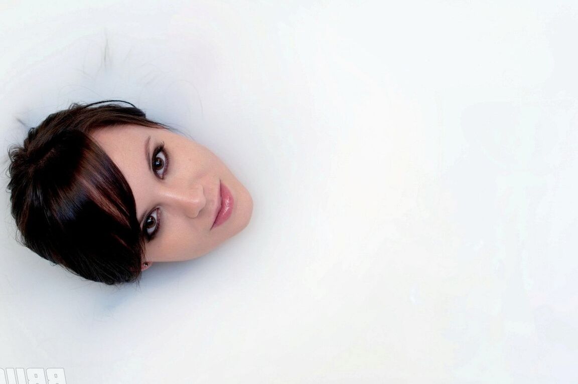 15P Dark haired beauty Bryci shows off her great body while taking a bubble bath