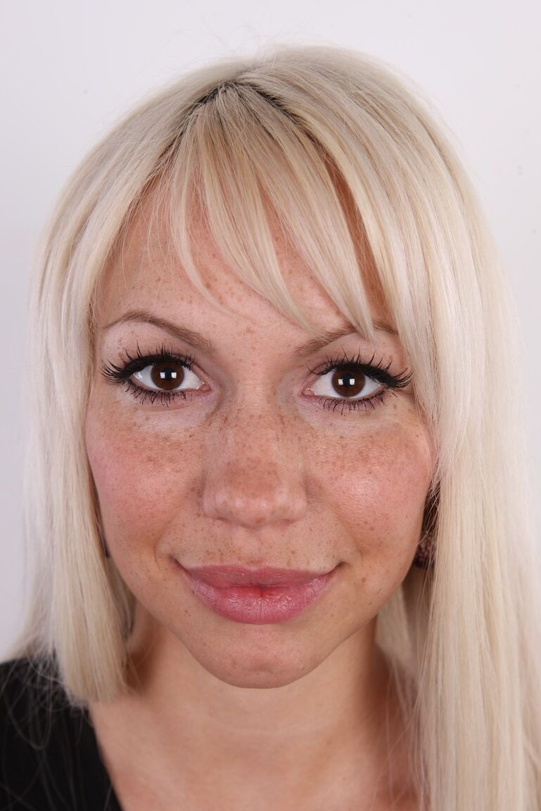 20P Blonde amateur with big areolas and freckles stands naked after undressing