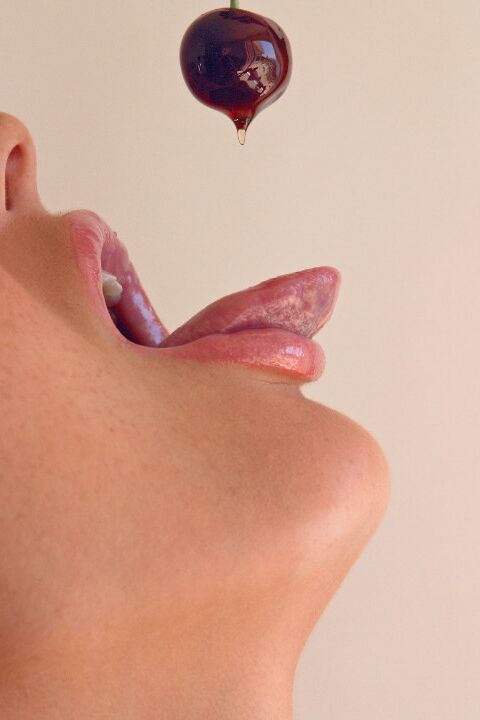 15P Pretty girl Sandra Shine curls her tongue while sucking juice from a cherry