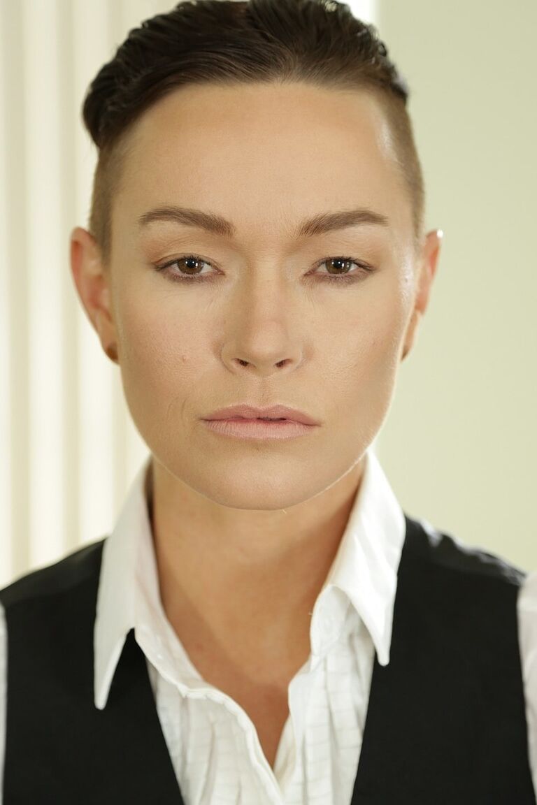 20P Androgynous short haired model Jiz Lee posing in her male outfit