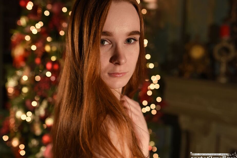 20P Young redhead Charlie gets totally naked in front of the Christmas tree