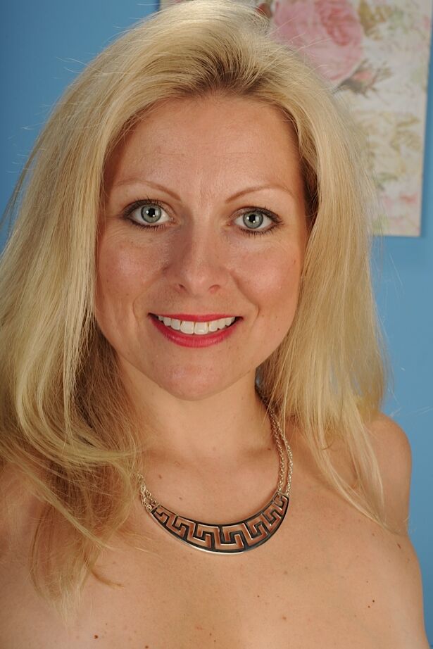 16P Older blonde MILF Zoey Tyler posing fully clothed before stripping nude