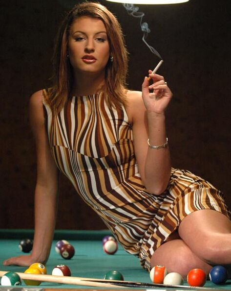 14P Beautiful chick smokes atop a pool table while baring her great tits and pussy