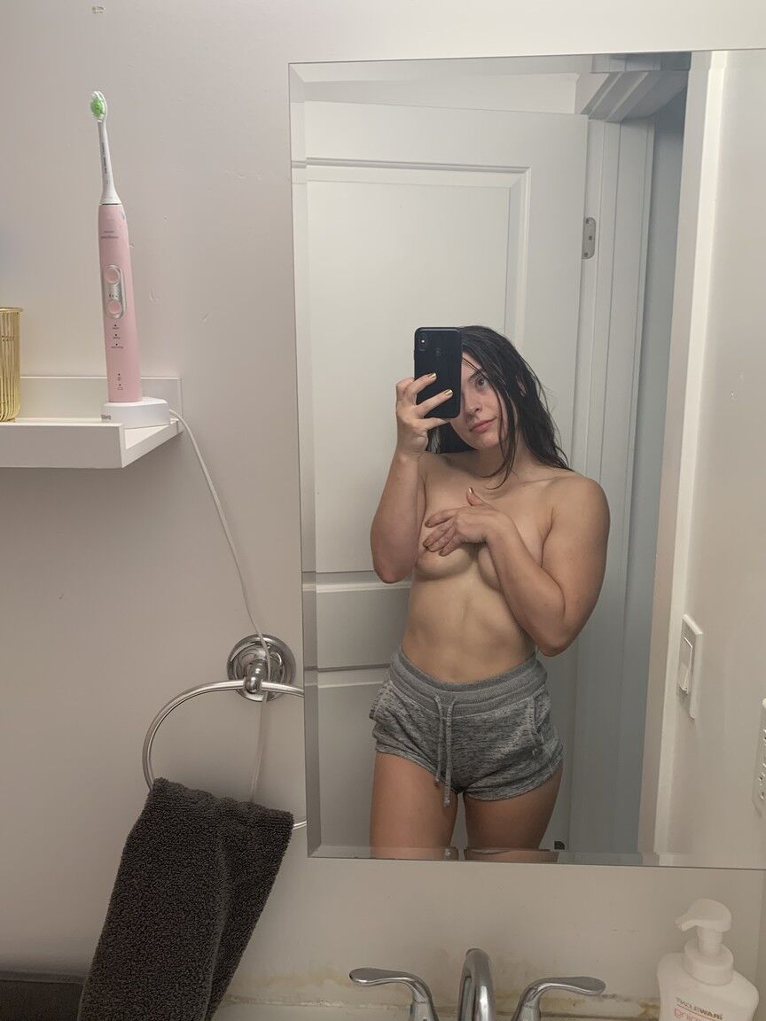 12P Solo model Abbie Maley takes mirror selfies while getting completely naked