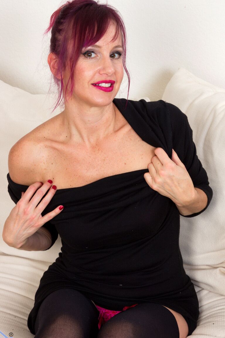 21P Redhead mature Heather masturbates with a vibrator after stripping