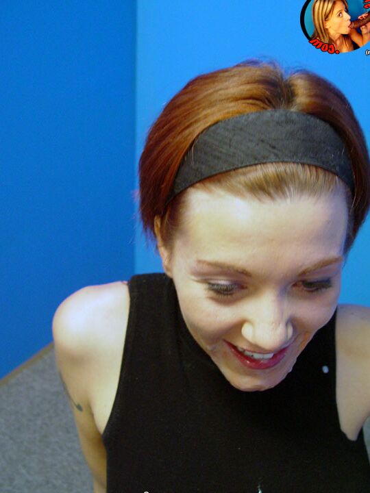 17P Redheaded chick Alisha Angel gets on her knees to blow a BBC at a gloryhole