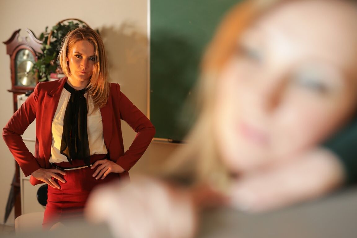 15P Blonde teacher puts a student into the stocks before lezdom action begins