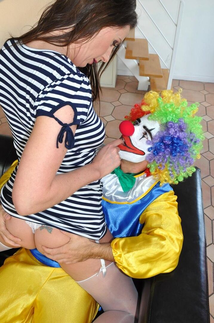 14P Mature lady has a sexual encounter with a clown in nylons and garters