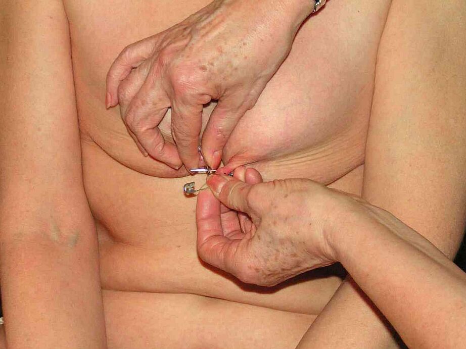 12P Restrained blonde lady has her nipples clamped and pierced with needles