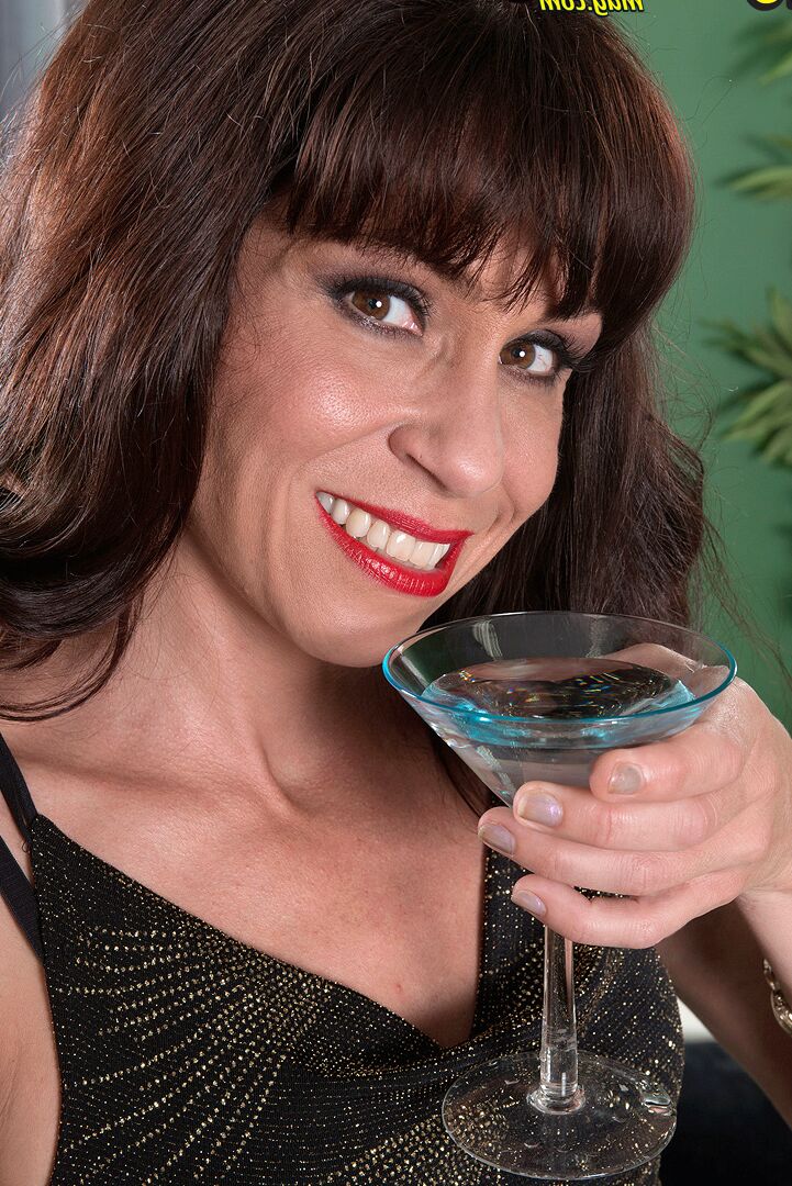 16P Mature lady Sage Quest downs a martini prior to undressing