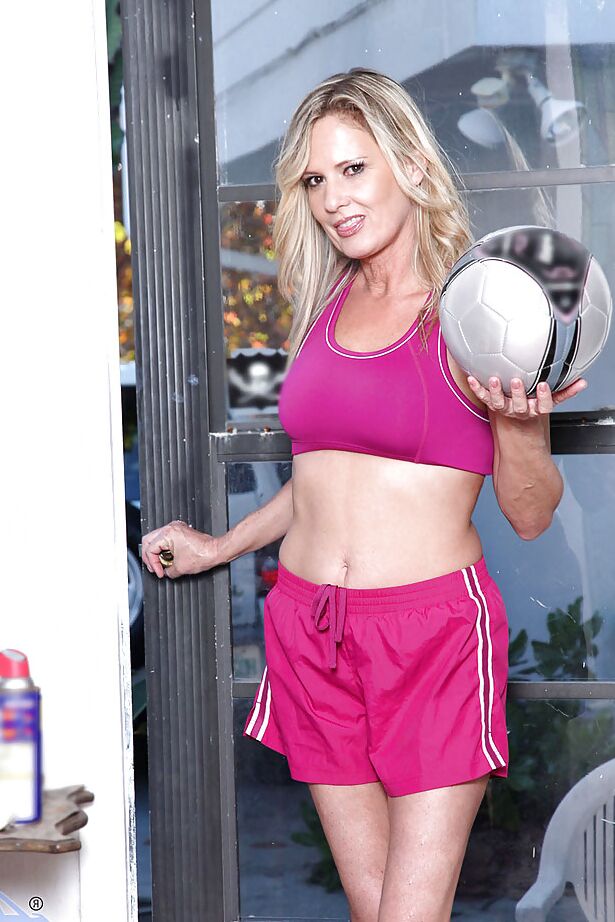 15P Gorgeous blond mom Bridgette Lee showing off her hooters in a sports class