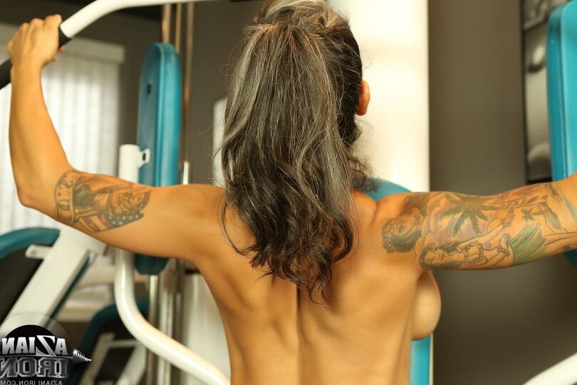 15P Fitness freak Dani Dupree showing her pierced clitoris working out at the gym