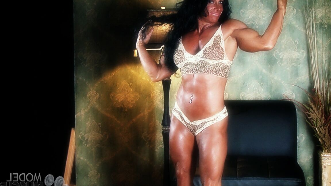 21P Sexy bodybuilder Debbie Bramwell teases with her muscles and pierced belly