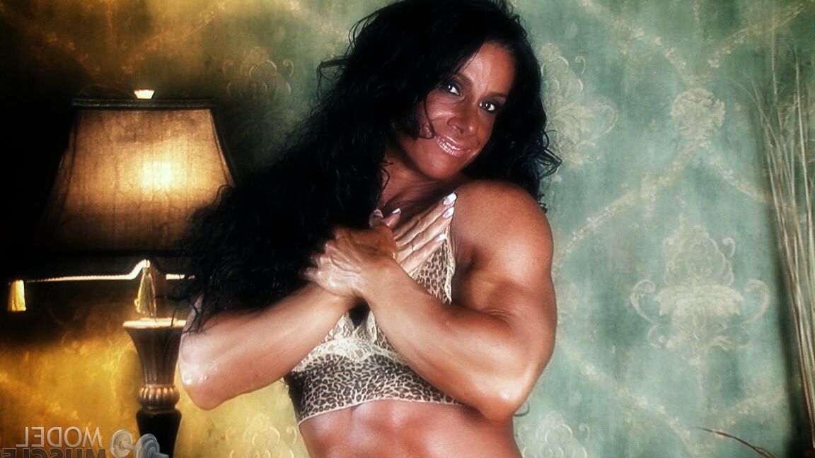21P Sexy bodybuilder Debbie Bramwell teases with her muscles and pierced belly