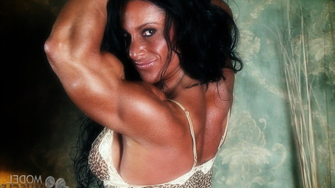 21P Sexy bodybuilder Debbie Bramwell teases with her muscles and pierced belly