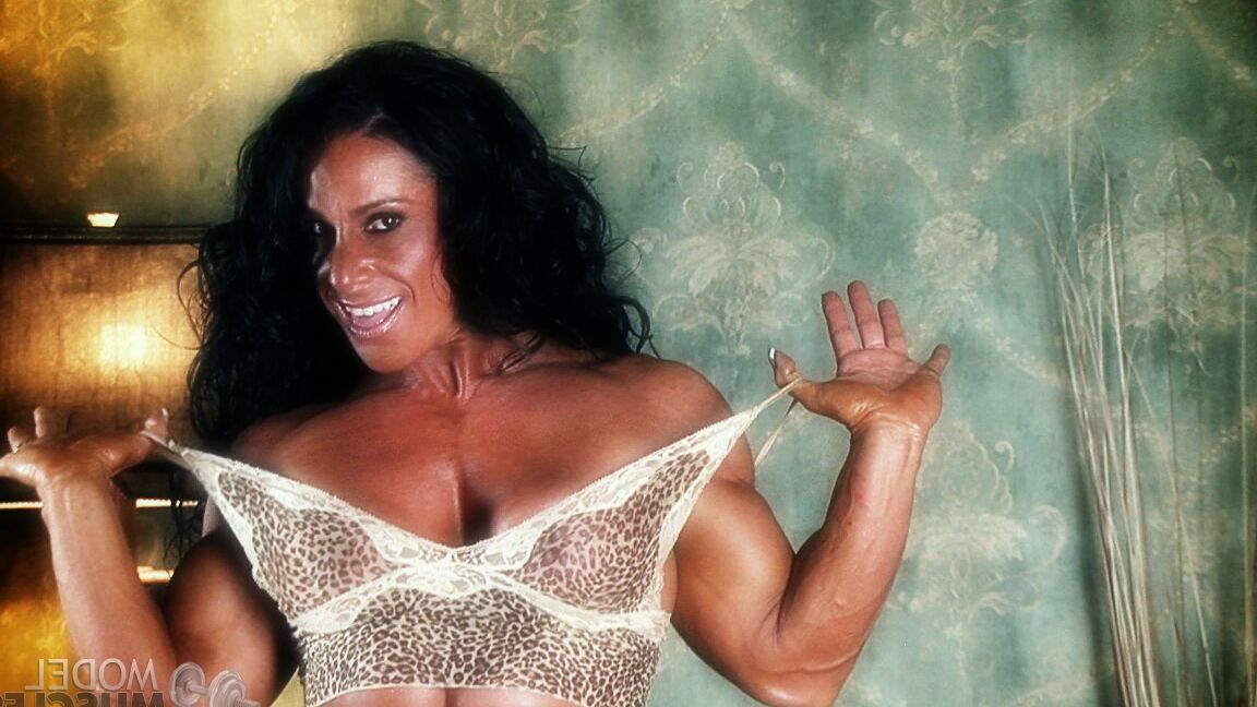 21P Sexy bodybuilder Debbie Bramwell teases with her muscles and pierced belly