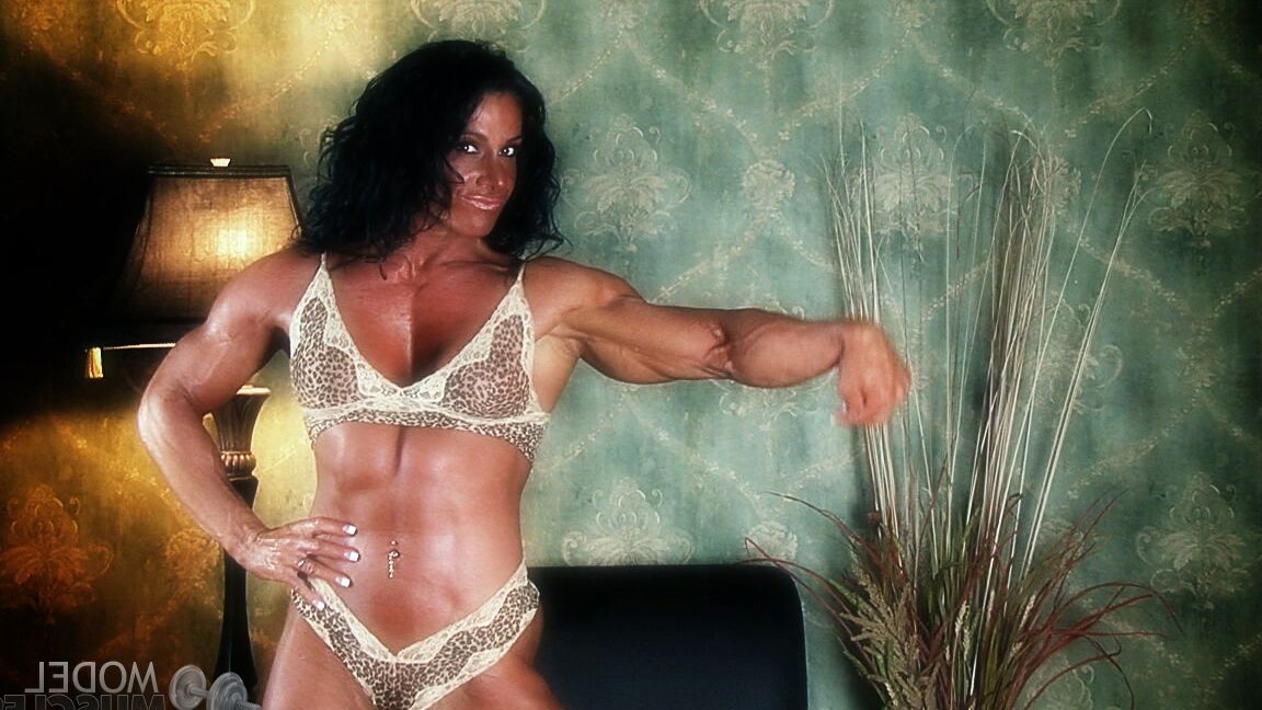 21P Sexy bodybuilder Debbie Bramwell teases with her muscles and pierced belly