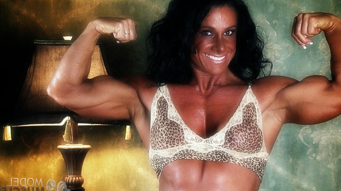 21P Sexy bodybuilder Debbie Bramwell teases with her muscles and pierced belly
