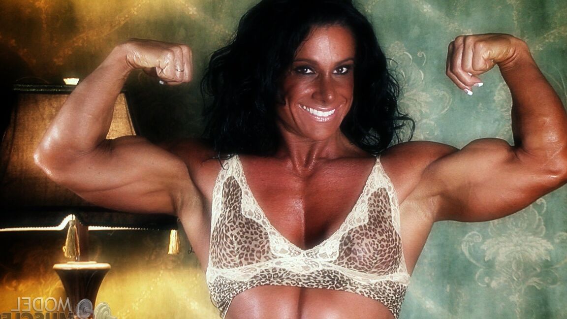 21P Sexy bodybuilder Debbie Bramwell teases with her muscles and pierced belly