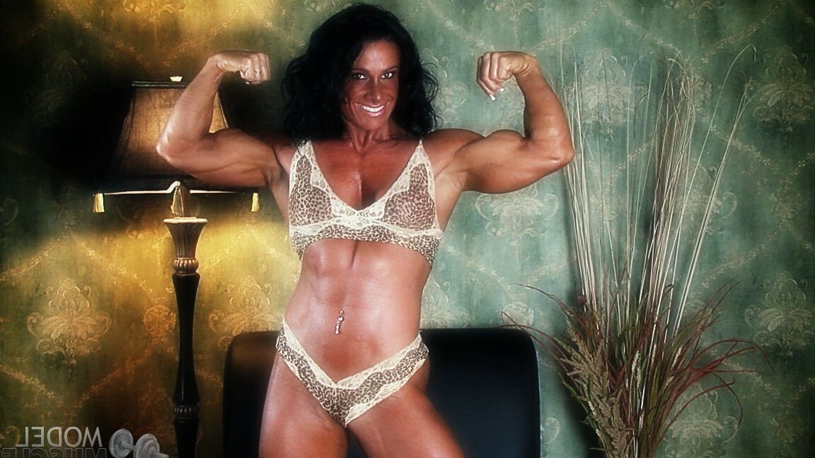 21P Sexy bodybuilder Debbie Bramwell teases with her muscles and pierced belly