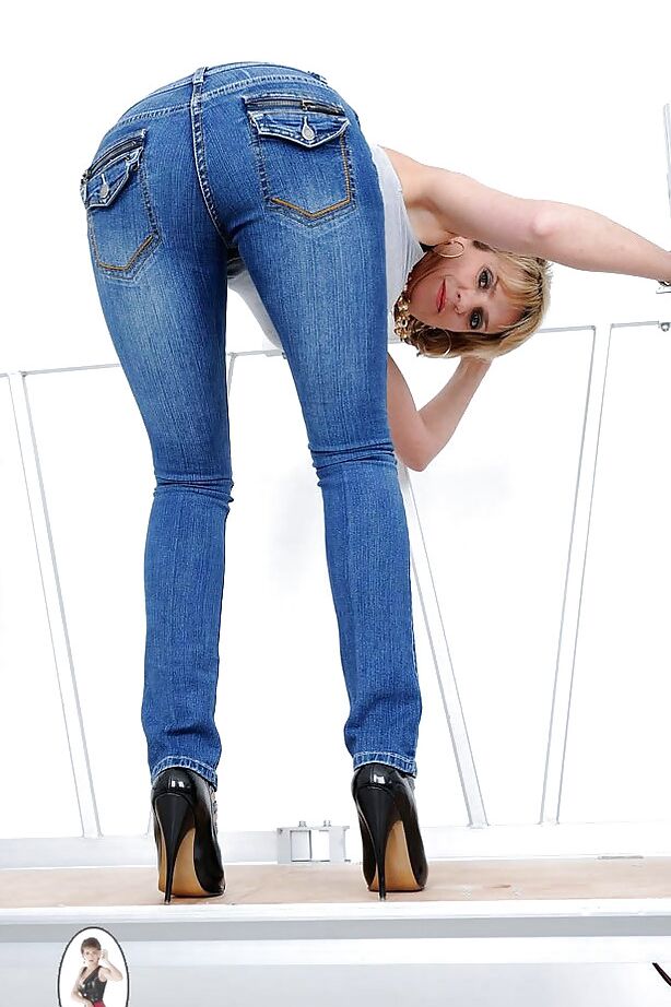 15P Leggy mature bombshell lowering her jeans and exposing her bald cooter