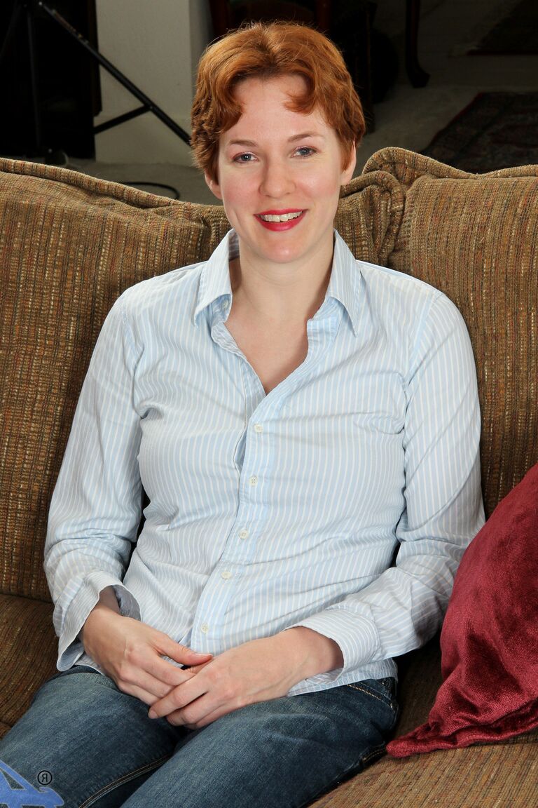21P Short-haired ginger Gigi strips and masturbates while reading a book