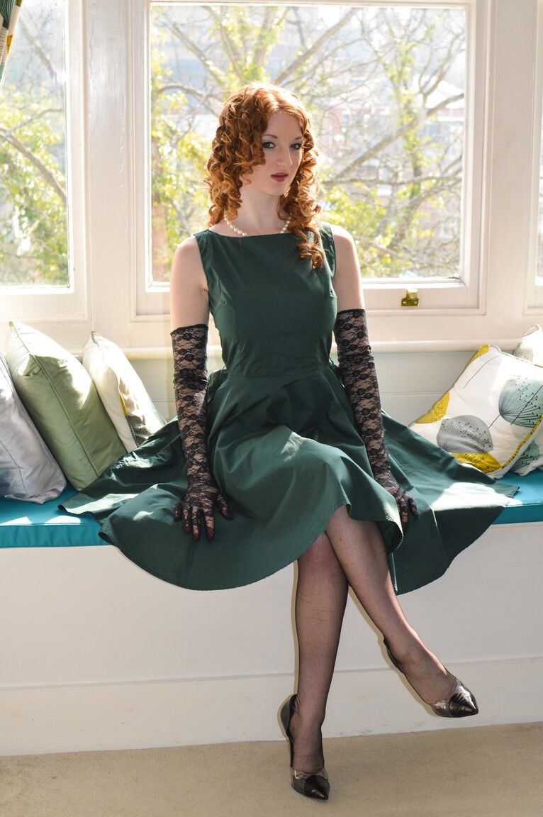 15P Leggy MILF Lara Latex invites and redhead to pose with her by window in nylons