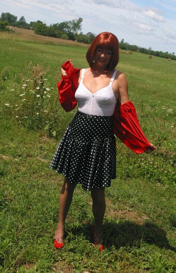 12P Older redhead Lauren models a retro girdle and nylons in a field