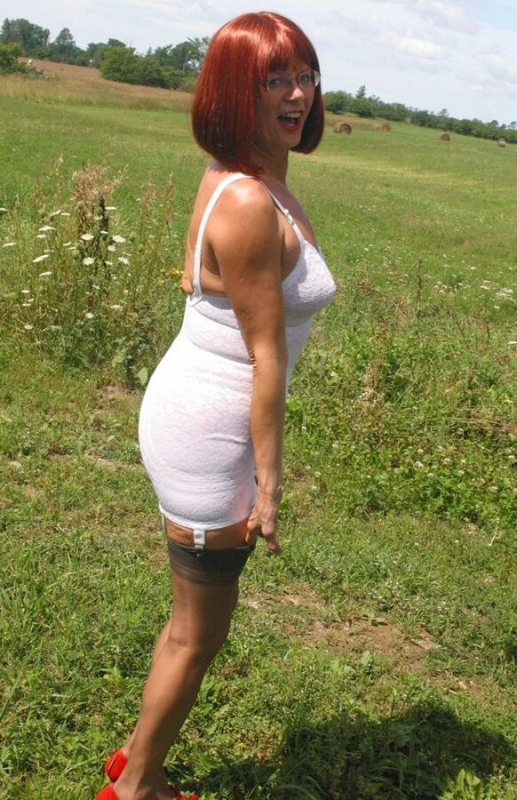 12P Older redhead Lauren models a retro girdle and nylons in a field
