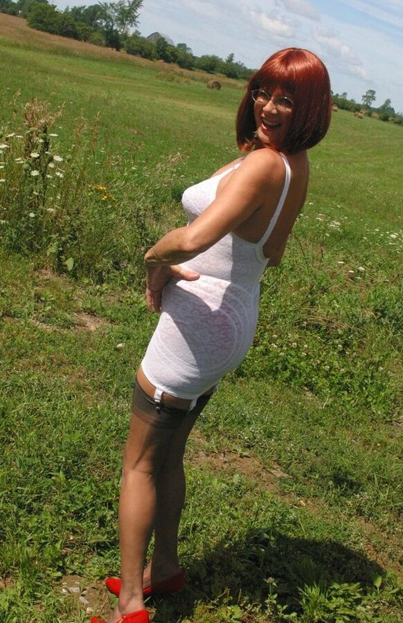 12P Older redhead Lauren models a retro girdle and nylons in a field