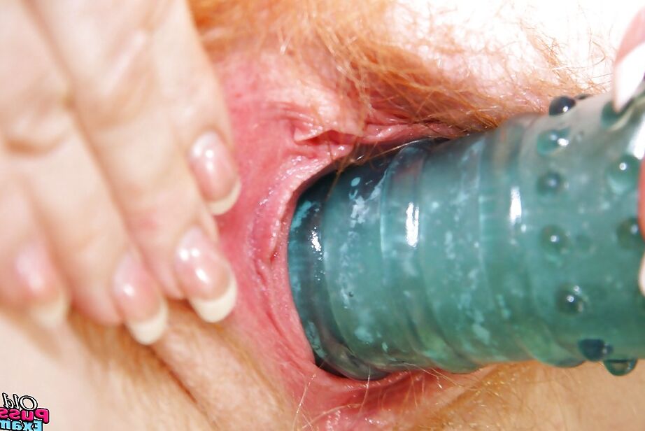 16P Mature nurse in glasses revealing her pink twat and toying it