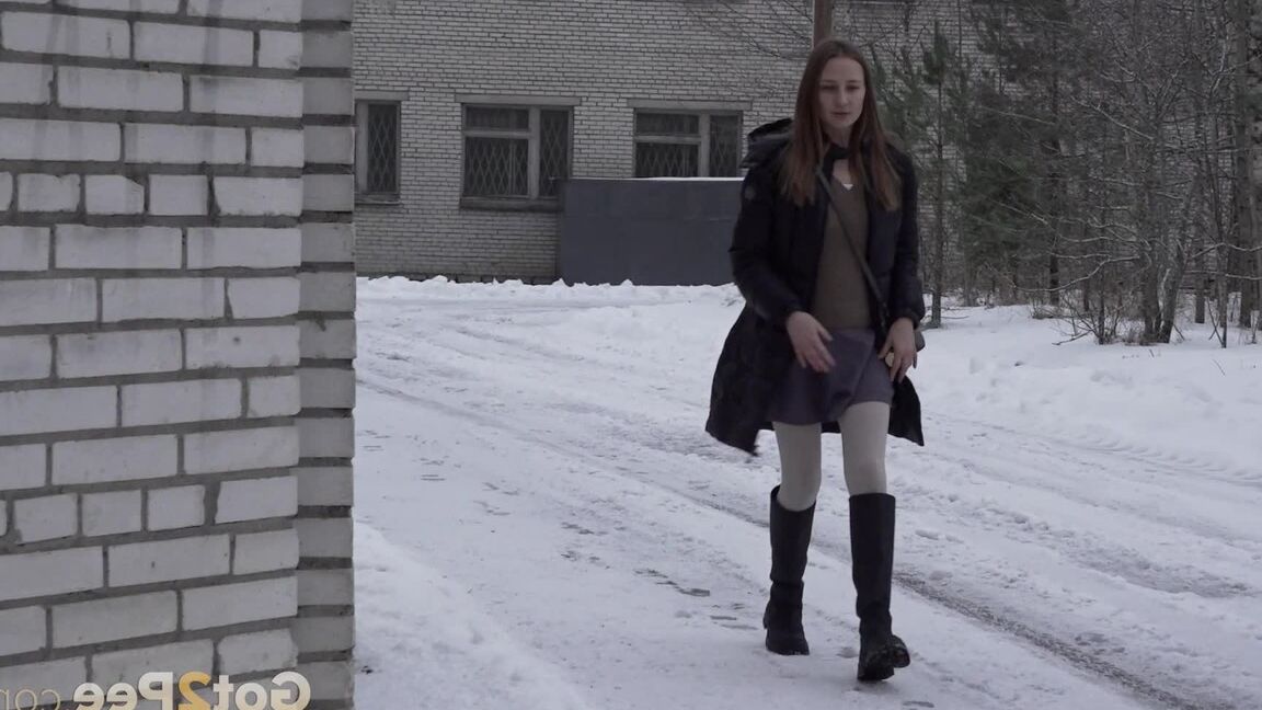 15P Caucasian girl Valya takes a piss in the snow after ducking behind a building