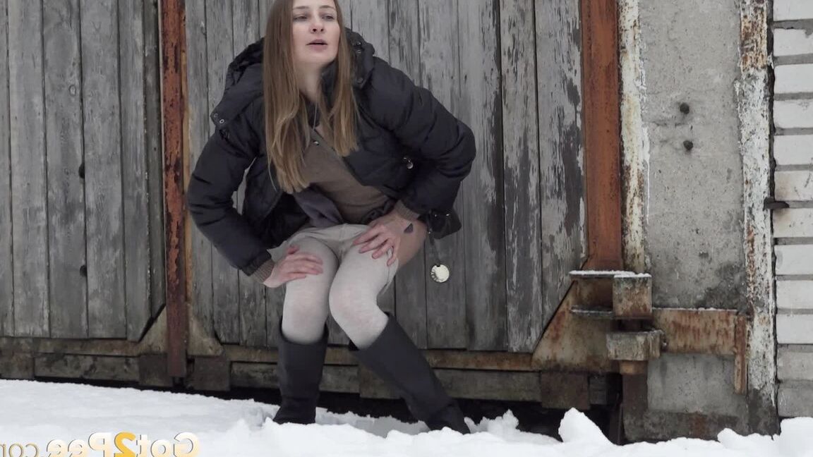 15P Caucasian girl Valya takes a piss in the snow after ducking behind a building