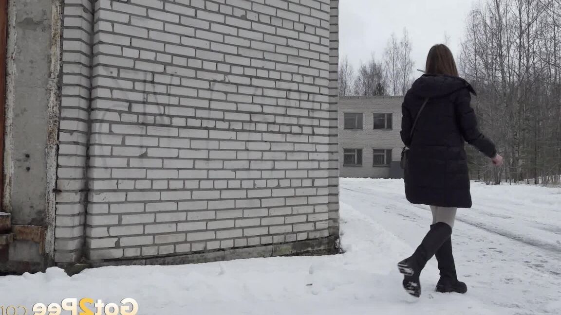 15P Caucasian girl Valya takes a piss in the snow after ducking behind a building